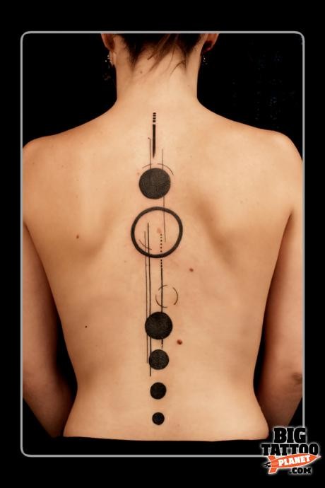geometric abstract tattoo black circles spine tattoo