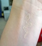 pagan tattoo white ink snake