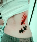 realistic tattoo black and red fish