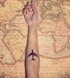 travel tattoo plane on arm