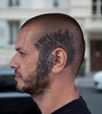 head tattoo around ear blue ink