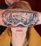 mountain reflection into ski goggles tattoo