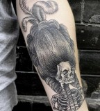 skeleton with big  hair tattoo by valentin hirsch
