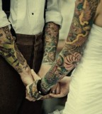 tattooed couple tattoo sleeves on wedding day