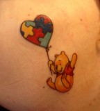 winnie the pooh and puzzle balloon tattoo