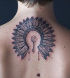 key and indian feather head piece tattoo by diana katsko