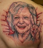 Betty White popping out of a bloody hole  tattoo