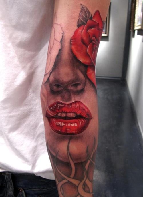 Lips tattoo on arm