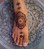 Ornaments foot tattoo