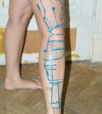 blue ink tattoo abstract leg work