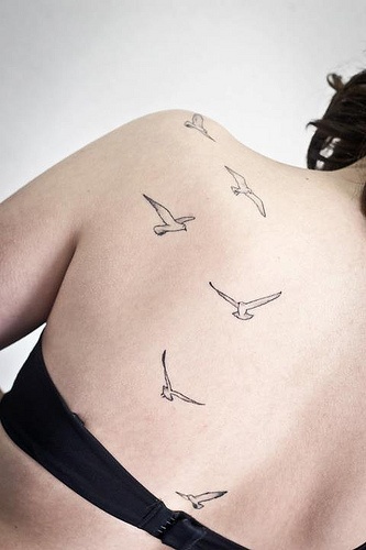 girly tattoo birds on back