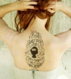typographic back tattoo and days went by like paper in the wind