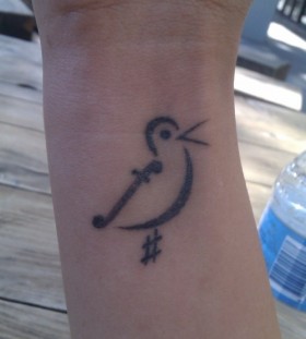 Bird symbol of music tattoo