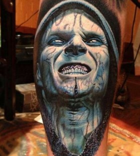 Blue scary tattoo