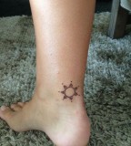 Leg sun tattoo