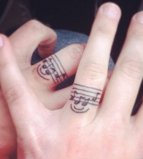 Smile and fingers music tattoo