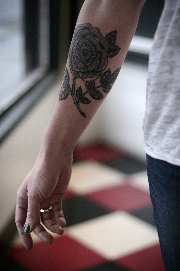 alice-carrier-tattoo-black-flower-on-arm.jpg