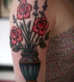 alice carrier tattoo vase of flowers on arm