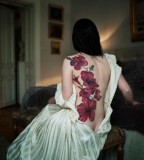 back tattoo design for women elegant red flowers