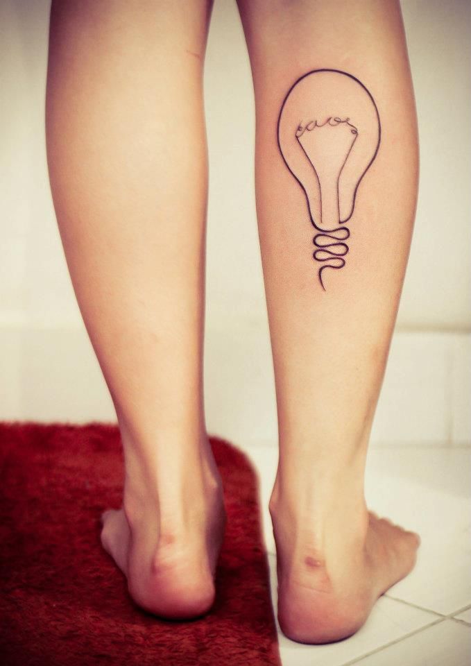 black ink minimalist light bulb tattoo on leg