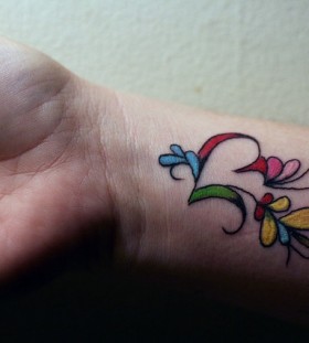 wrist tattoo colorful work