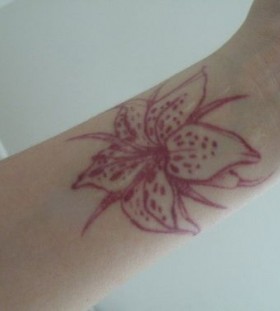 wrist tattoo red ink flower