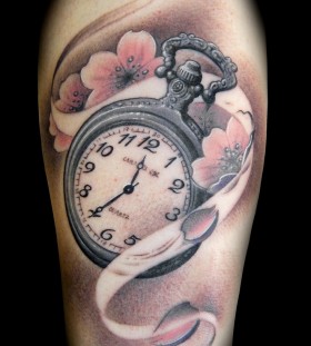 Flowers and clock tattoo