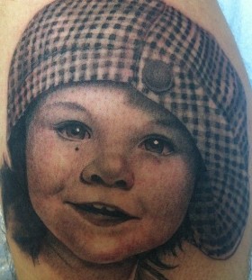Kid tattoo by Corey Miller