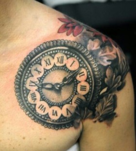 Shoulder clock tattoo