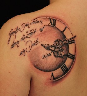 Words and clock tattoo