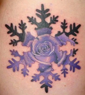 small purple snowflake tattoo