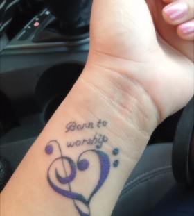 small purple tattoo born to