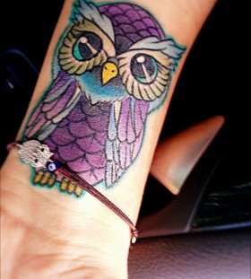 small purple tattoo owl