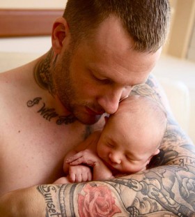 Cute baby and men tattoo