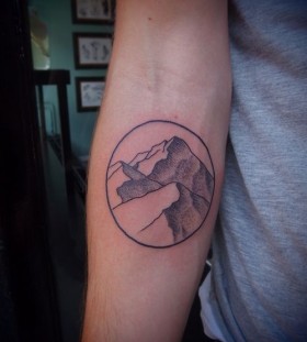 Hand mountains tattoo