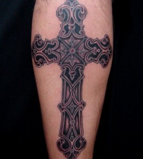 Impressive black cross tattoo