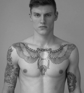 Adorable boy tattoo on chest