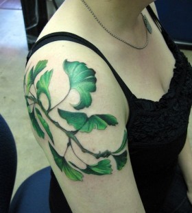 Green leaf tattoo