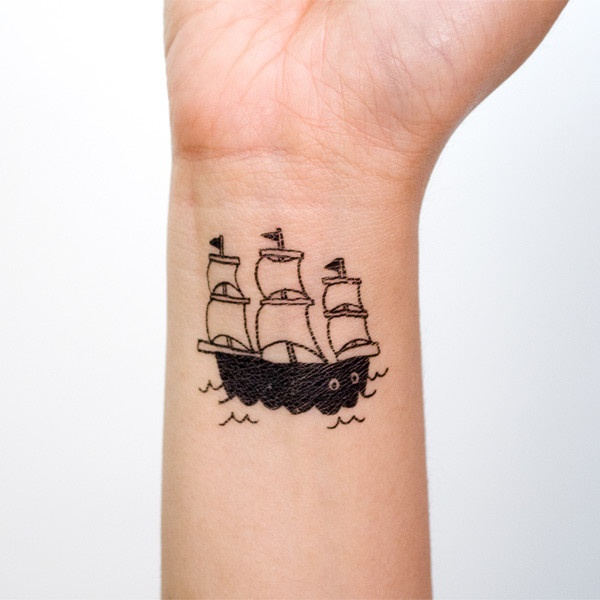 Pretty small ship tattoo