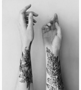 Realistic hand leaf tattoo