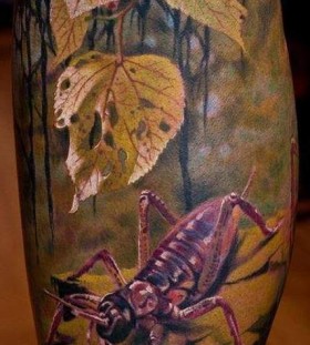 Watercolor insect tattoo
