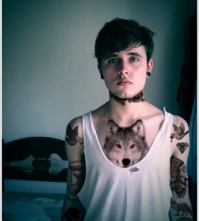 Young boy wolf tattoo on chest