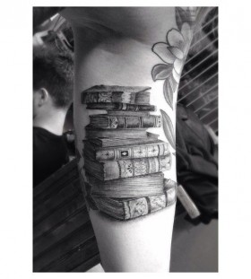 Adorable black book tattoo on arm