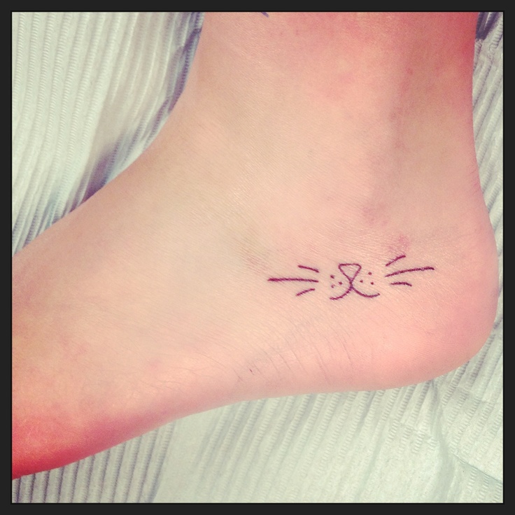 Adorable pretty cat tattoo on finger