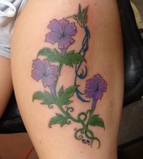 Adorable purple flower tattoo on leg