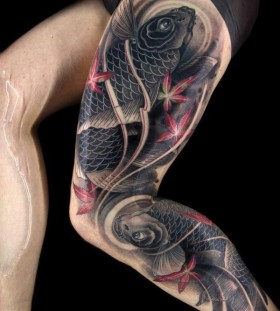 Black adorable fish tattoo on leg