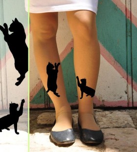 Black women cat tattoo on leg
