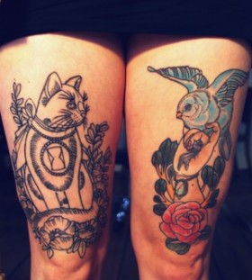 Blue bird and cat tattoo on leg