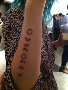 Blue hair girl moon tattoo on arm
