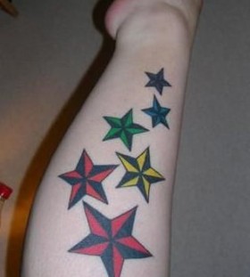 Colorful flowers star tattoo on arm